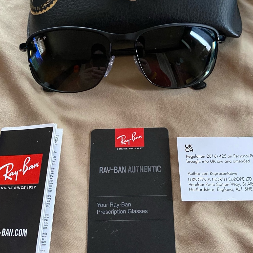 Prescription Ray-Ban protective glasses.